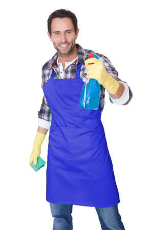 Portrait of a man with sponge and spray ready to clean windows. Isolated on whiteの写真素材