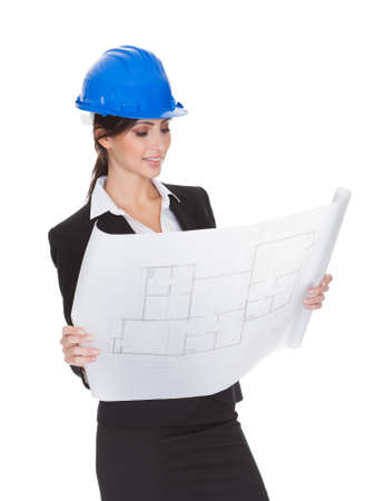 Female Architect Holding Blueprints. Isolated On Whiteの写真素材