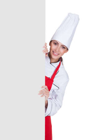 Happy Female Chef Holding Placard. Isolated On Whiteの写真素材