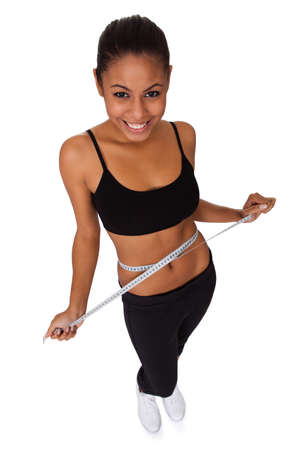 Happy Woman With Measure Tape. Isolated On Whiteの写真素材