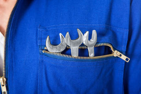 Portrait of happy automechanic. Isolated on whiteの写真素材