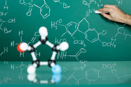 Model of molecular structure on green reflective backgroundの写真素材