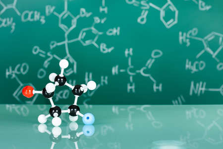 Model of molecular structure on green reflective backgroundの写真素材