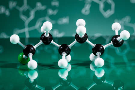 Model of molecular structure on green reflective backgroundの写真素材