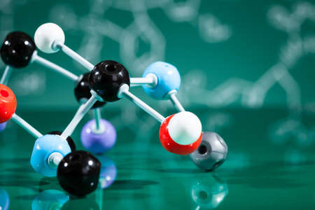 Model of molecular structure on green reflective backgroundの写真素材