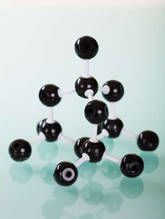 Model of graphite  molecular structure on green reflective background