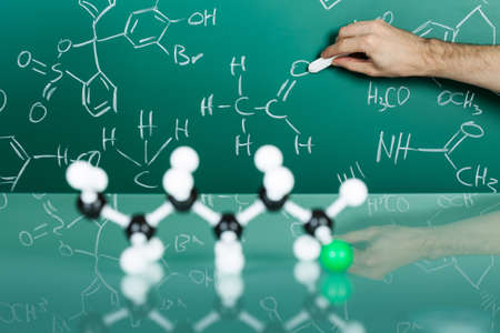 Model of molecular structure on green reflective backgroundの写真素材