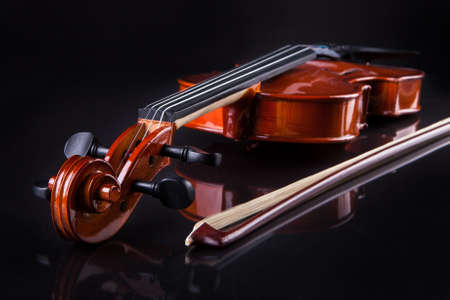 Close-up Of Vintage Violin Over Black Backgroundの写真素材