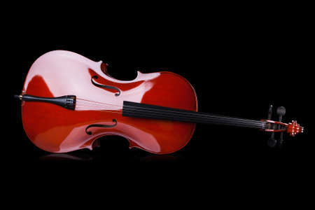 Close-up Of Vintage Cello Over Black Backgroundの写真素材