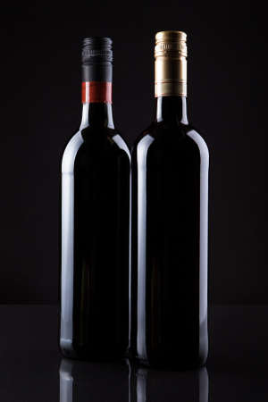 Two Bottles Of Wine Isolated On Black Background