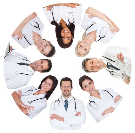 Low angle view of diverse group of doctors. Isolated on whiteの写真素材
