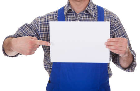 Mature Male Technician Holding Empty Sheet Over White Backgroundの写真素材
