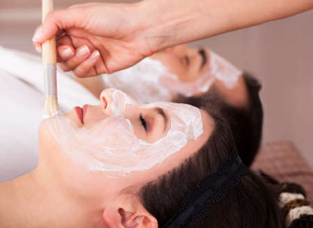 Close-up Of Couple With Face Mask In Spa Centre
