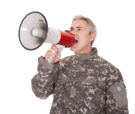 Mature Soldier Shouting Through Megaphone Isolated On White Backgroundの写真素材