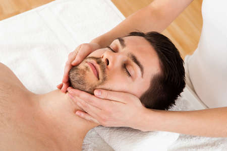 Man getting massage in the spa centreの写真素材