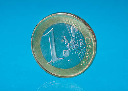 Photo Of One Euro Coin Over Blue Backgroundの写真素材