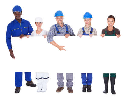 People With Diverse Professions Holding Placard Over White Background