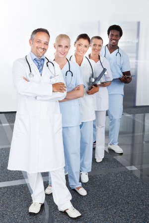 Group Of Happy Multiracial Doctors Standing In A Rowの写真素材
