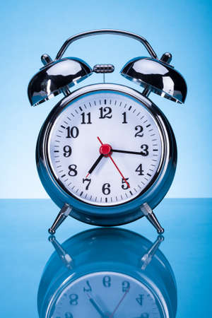 Photo Of Alarm Clock Over Blue Background
