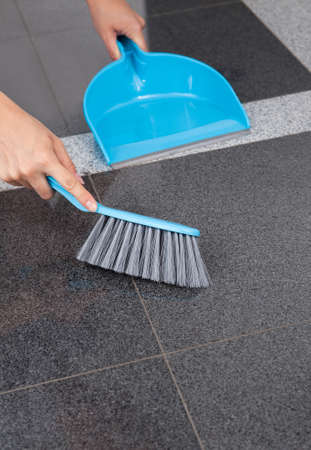 Maid Cleaning The Floor With Mop In Officeの写真素材