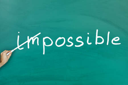 Everything is possible concept on green blackboardの写真素材