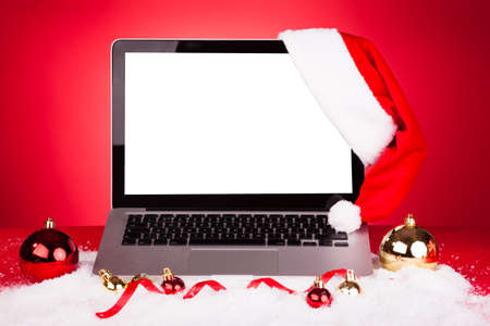 Blank Laptop With Santa Hat And Christmas Decorationの写真素材