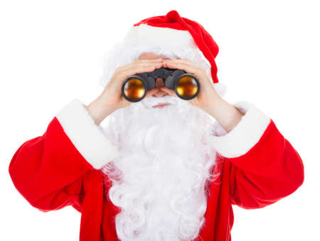 Close-up of santa looking in binocular on white backgroundの写真素材