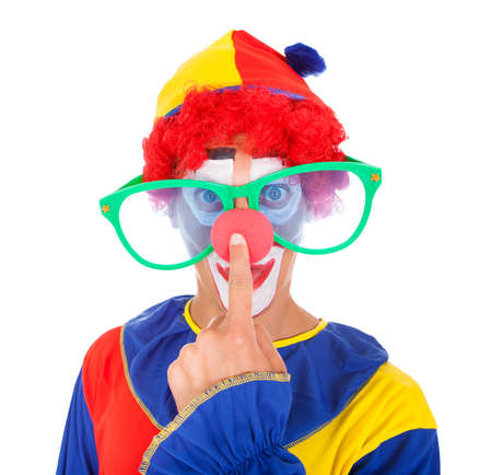 Close-up Of A Funny Joker With Big Eyeglasses Pointing On Noseの写真素材
