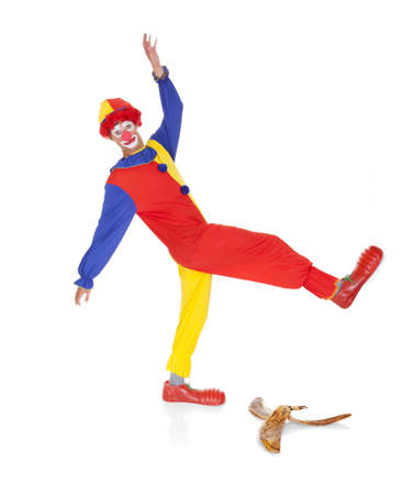Joker About To Fall On Banana Skin Over White Background
