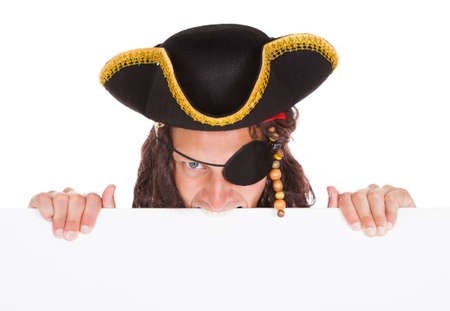 Angry Pirate Holding Blank Placard In Mouth On White Backgroundの写真素材