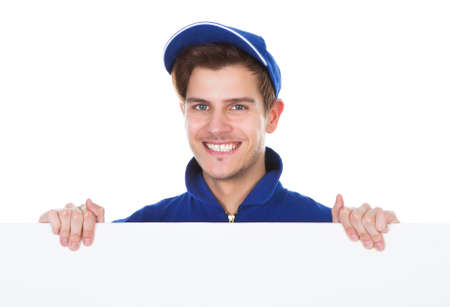 Portrait Of A Male Worker Cleaning Floor With Mop