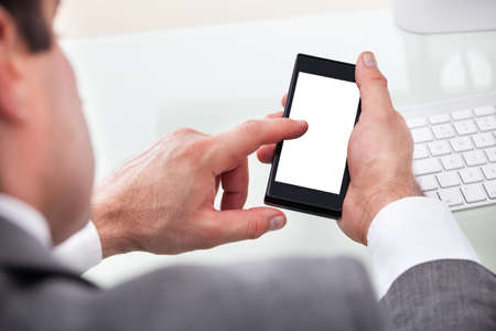 Close-up Of A Person Holding Cellphone With Blank Screen