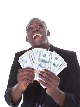 Young African Businessman Holding Banknote Looking Up