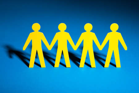 Paper People Team Isolated Over Blue Backgroundの写真素材