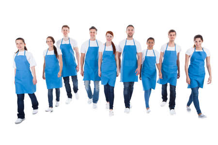 Professional cleaners walking towards camera. Isolated on white