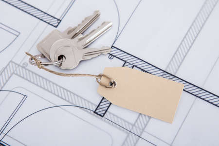 Closeup of keys with tag on blueprintの写真素材