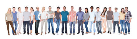 Panoramic shot of diverse people in casuals standing against white background