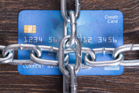 Chained credit card in secure payments conceptの写真素材
