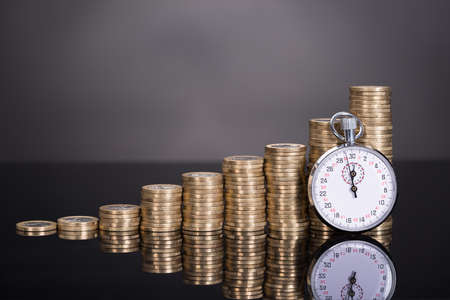 Time is money concept over black background Time is money concept over black background