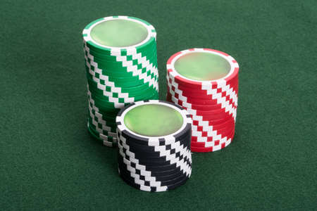 Close-up shot of casino chips on poker tableの写真素材