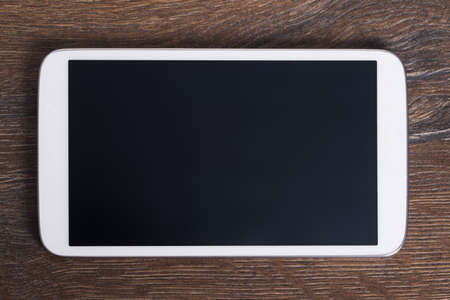 Photo of modern tablet with empty screenの写真素材