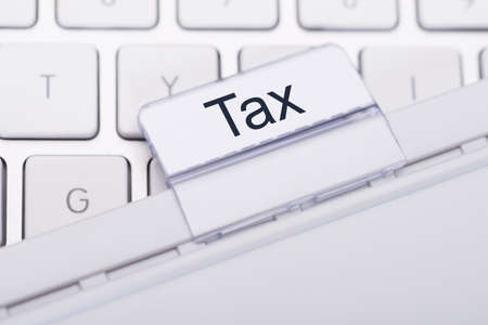 Closeup of Tax tab attached to keyboardの写真素材