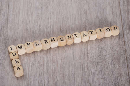 Idea Implementation wooden blocks arranged on tableの写真素材