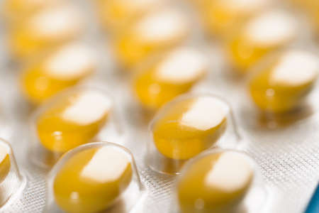 Close-up Of Yellow Pills Packed In Blistersの写真素材