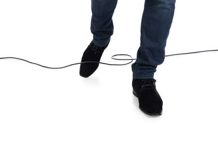 Close-up Of Person Stucked In Cable While Walking Over White Backgroundの写真素材