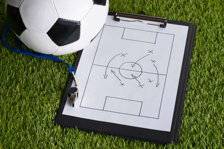 Ball; Whistle And Soccer Tactic Diagram On Paper Over Pitchの写真素材