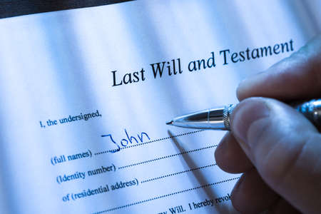Close-up Of A Person Writing Last Will and Testament
