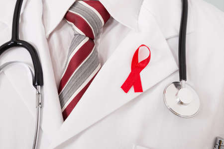 Close-up Of A Doctor With Stethoscope And Aids Ribbon