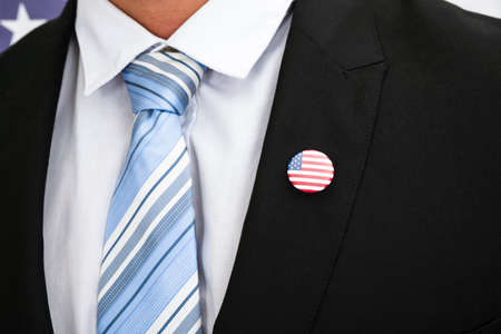 Close-up Of Businessman In Suit Wearing American Badge