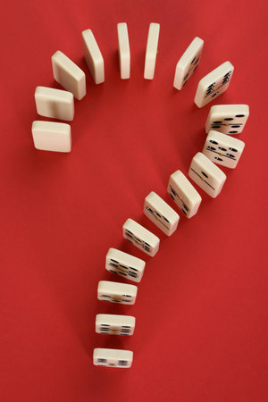 Question Mark Made From Domino On Red Backgroundの写真素材